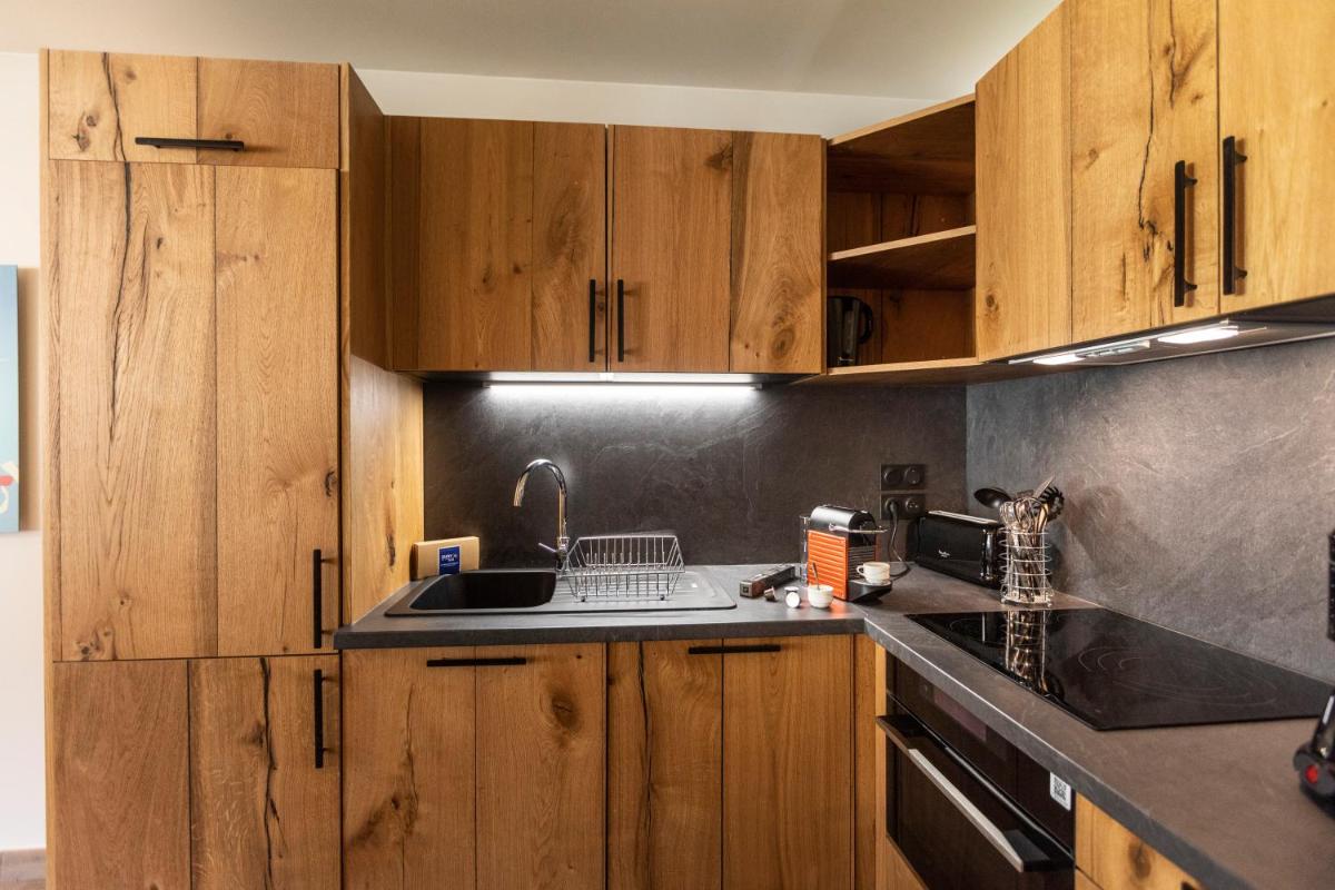 Cuisine ou kitchenette dans l'établissement Résidence Club MMV Samoens