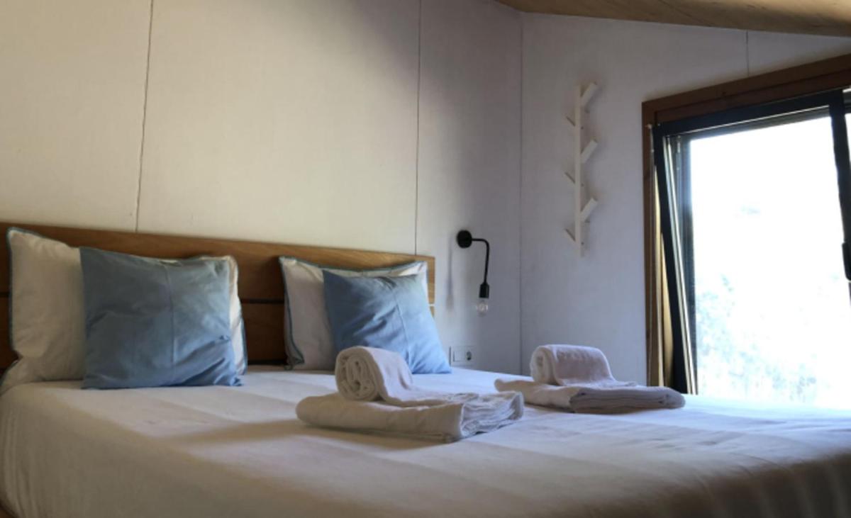Uma cama ou camas num quarto em Bukubaki Eco Surf