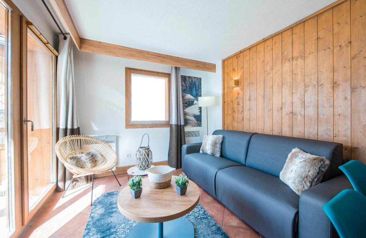 Coin salon dans l'établissement Résidence Club mmv Le Hameau des Airelles ****
