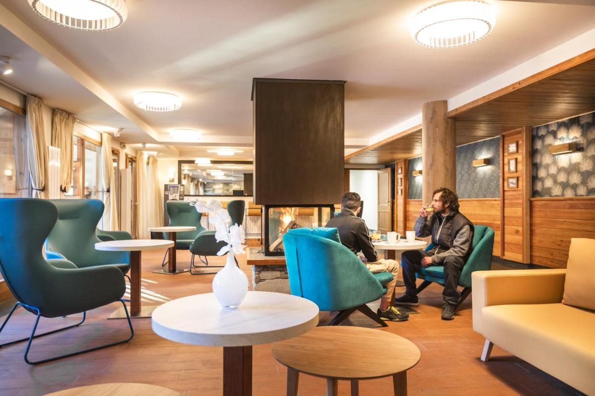 Coin salon dans l'établissement Résidence Club mmv Le Hameau des Airelles ****