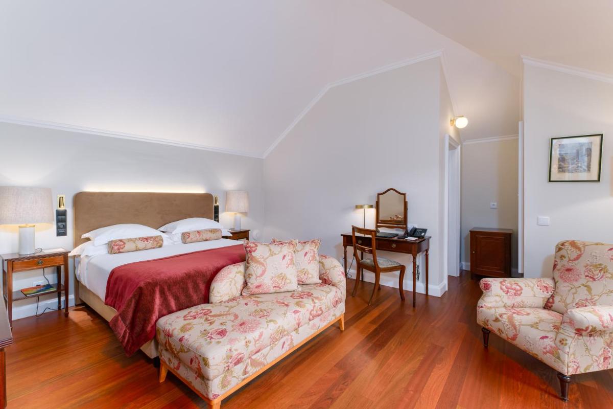 Uma cama ou camas num quarto em Casa Velha do Palheiro Relais & Chateaux