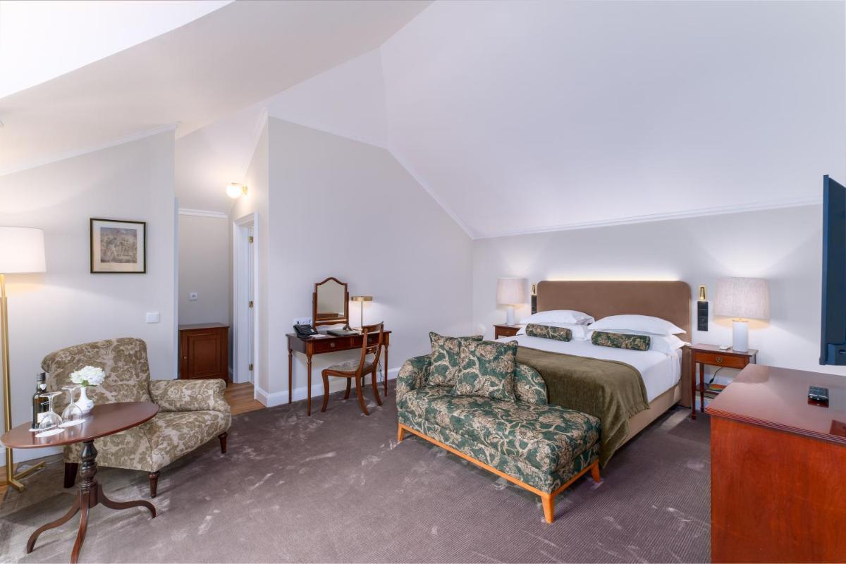 Uma cama ou camas num quarto em Casa Velha do Palheiro Relais & Chateaux