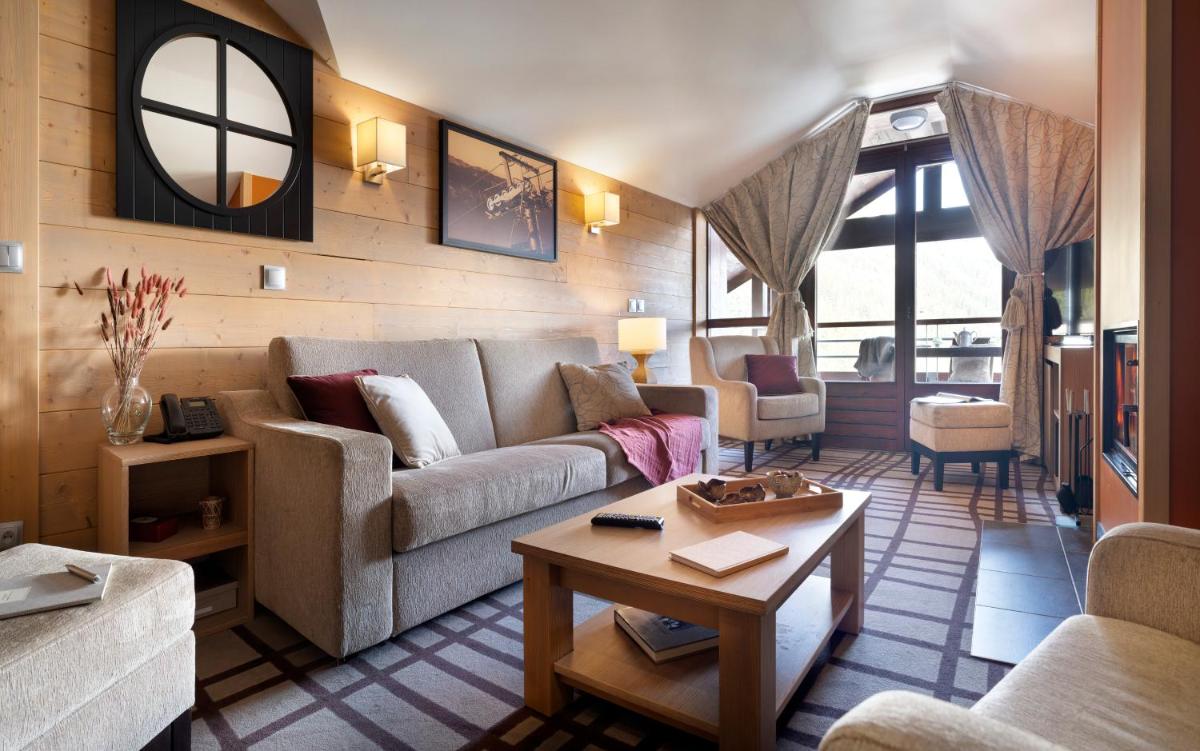 Coin salon dans l'établissement Résidence Pierre & Vacances Premium Les Terrasses d'Hélios