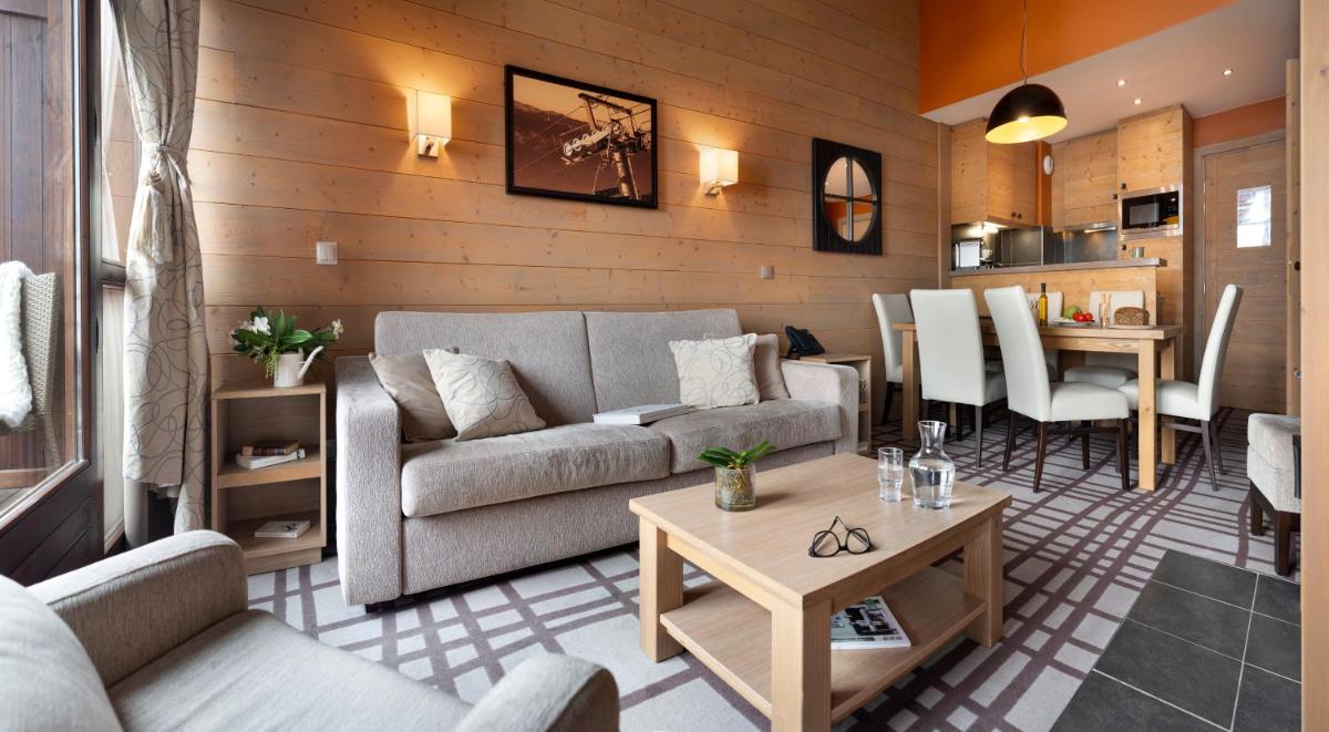 Coin salon dans l'établissement Résidence Pierre & Vacances Premium Les Terrasses d'Hélios