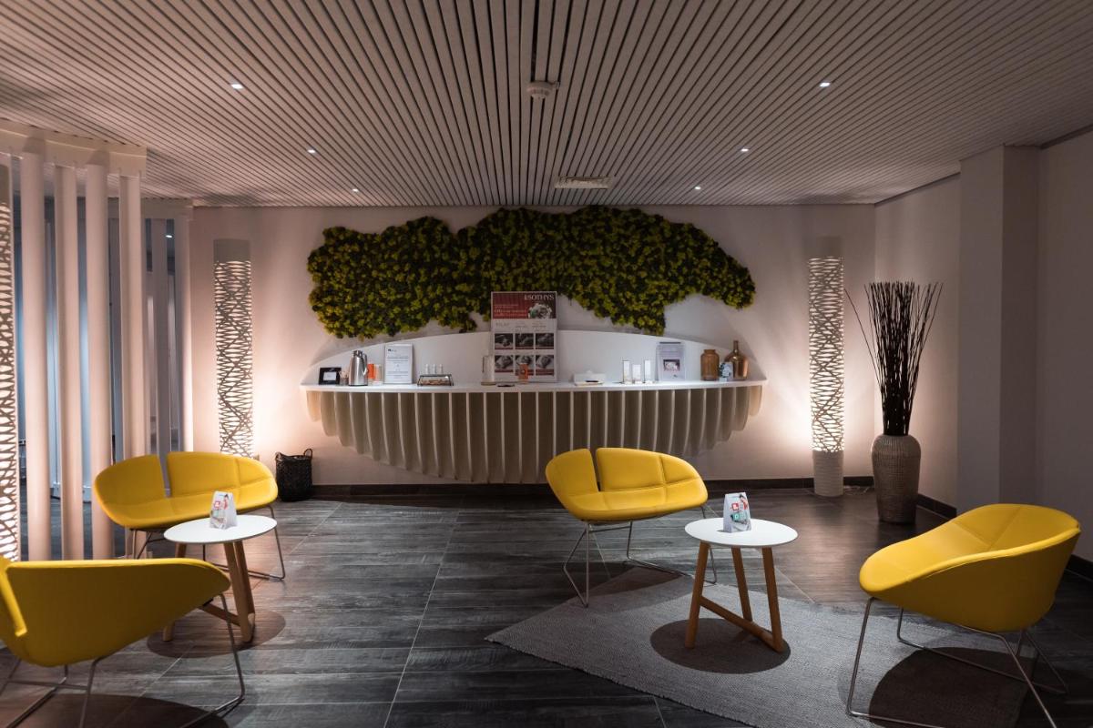 Coin salon dans l'établissement Radisson Blu Hotel Bordeaux