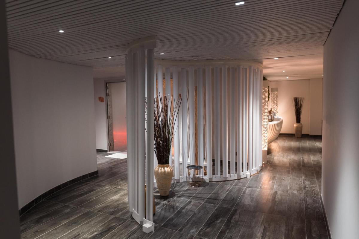 Un ou plusieurs lits dans un hébergement de l'établissement Radisson Blu Hotel Bordeaux
