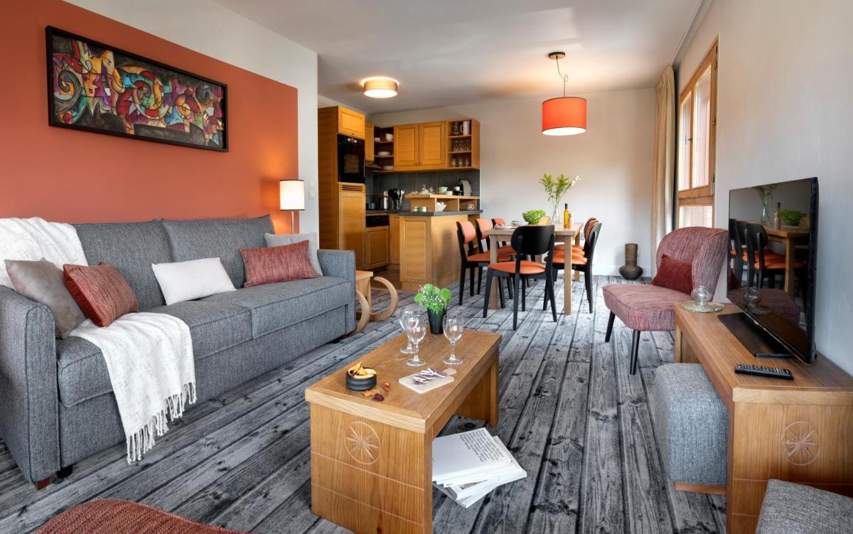 Coin salon dans l'établissement Résidence Pierre & Vacances Premium Les Terrasses d'Eos