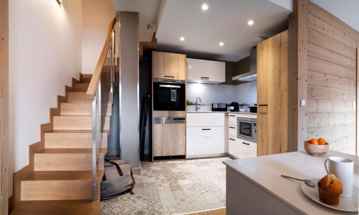 Cuisine ou kitchenette dans l'établissement Résidence Pierre & Vacances Premium L'Hévana