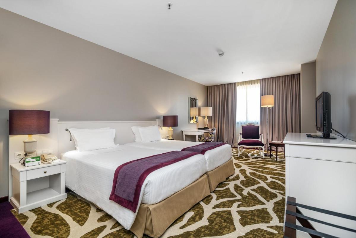 Uma cama ou camas num quarto em Holiday Inn Porto Gaia by IHG