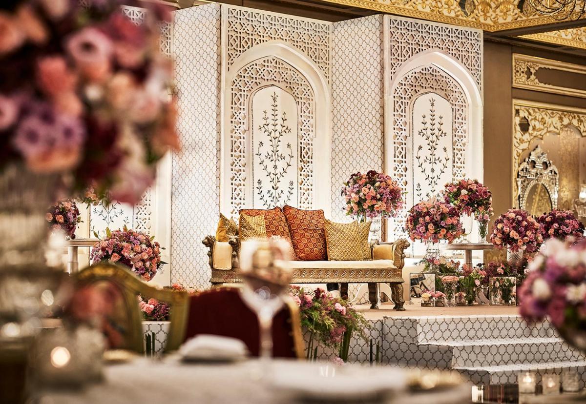 a rendering of a living room with a couch and flowers at Sawai Man Mahal in Jaipur