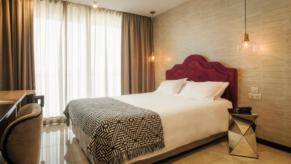 Un ou plusieurs lits dans un hébergement de l'établissement Hotel La Pietra Restaurant & Spa