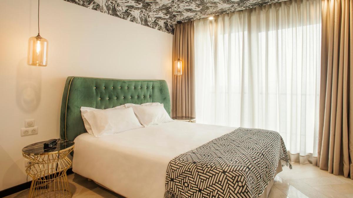 Un ou plusieurs lits dans un hébergement de l'établissement Hotel La Pietra Restaurant & Spa