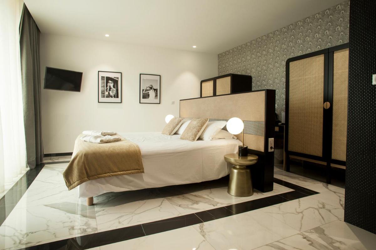 Un ou plusieurs lits dans un hébergement de l'établissement Hotel La Pietra Restaurant & Spa