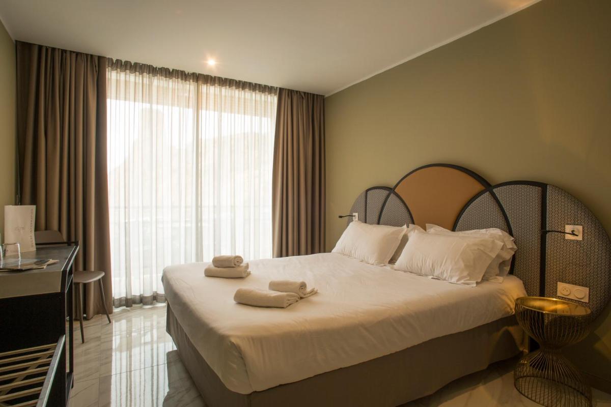 Un ou plusieurs lits dans un hébergement de l'établissement Hotel La Pietra Restaurant & Spa