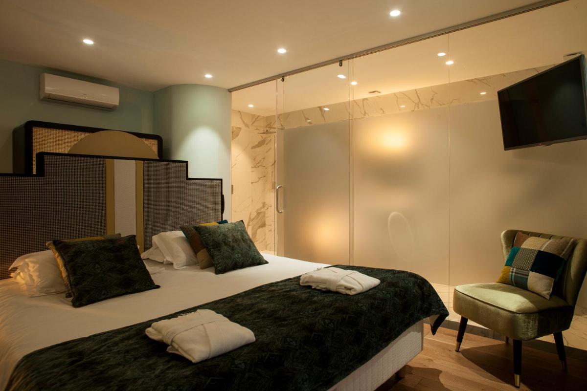 Un ou plusieurs lits dans un hébergement de l'établissement Hotel La Pietra Restaurant & Spa