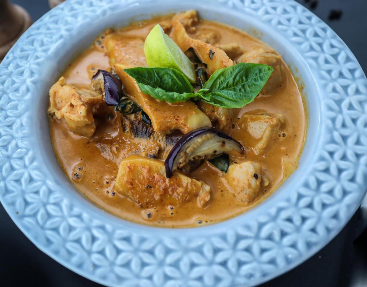 a bowl of soup on a white plate at Radisson RED Chandigarh Mohali in Chandīgarh