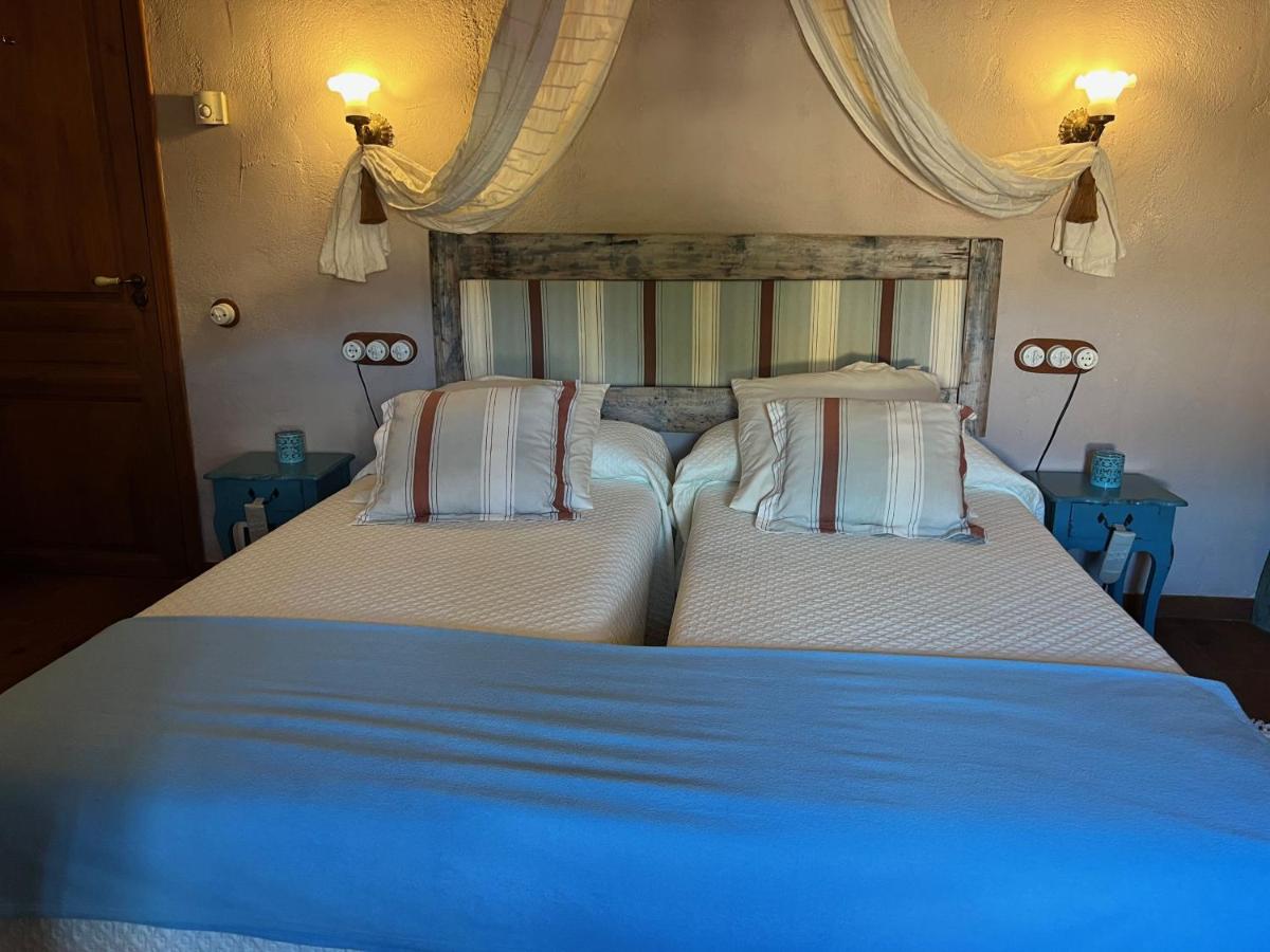 Cama o camas de una habitación en Les Vinyes Alojamiento Rural Boutique & SPA