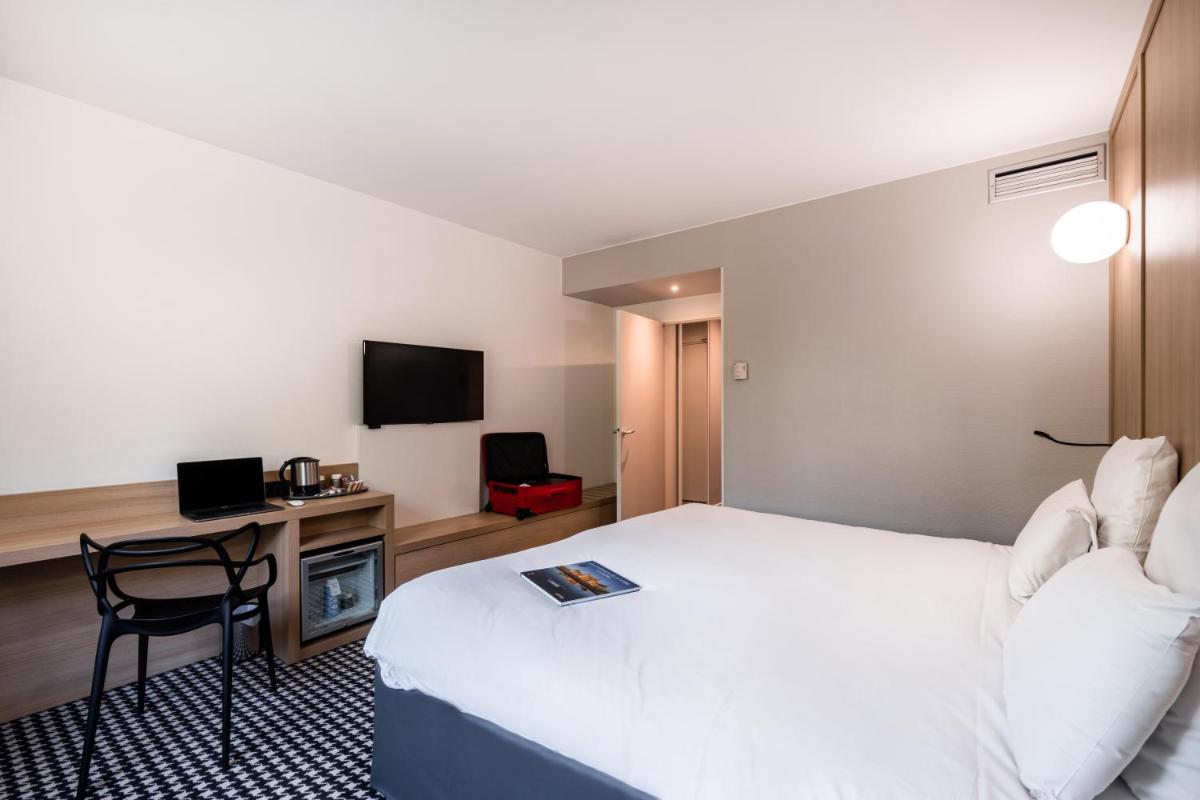 Télévision ou salle de divertissement dans l'établissement Mercure Tours Sud