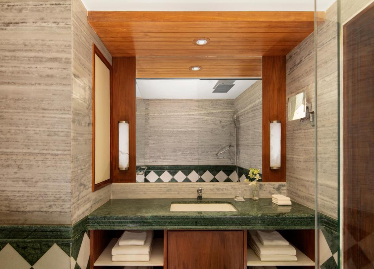 a bathroom with a sink and a mirror at Radisson Jodhpur in Jodhpur