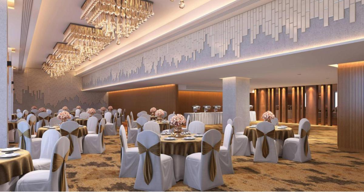 a banquet hall with tables and chairs and chandeliers at Hyatt Place Jaipur Malviya Nagar in Jaipur a banquet hall with tables and chairs and chandeliers at Hyatt Place Jaipur Malviya Nagar in Jaipur