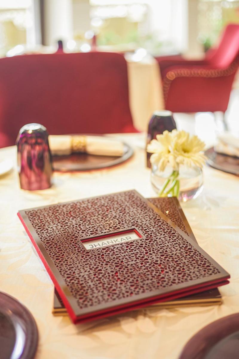 a laptop computer sitting on top of a table at Tajview, Agra-IHCL SeleQtions in Agra