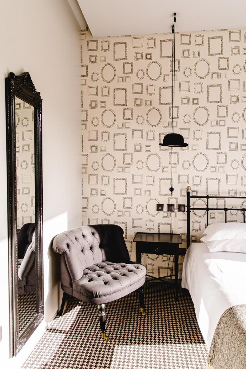 Uma cama ou camas num quarto em Cooking and Nature - Emotional Hotel