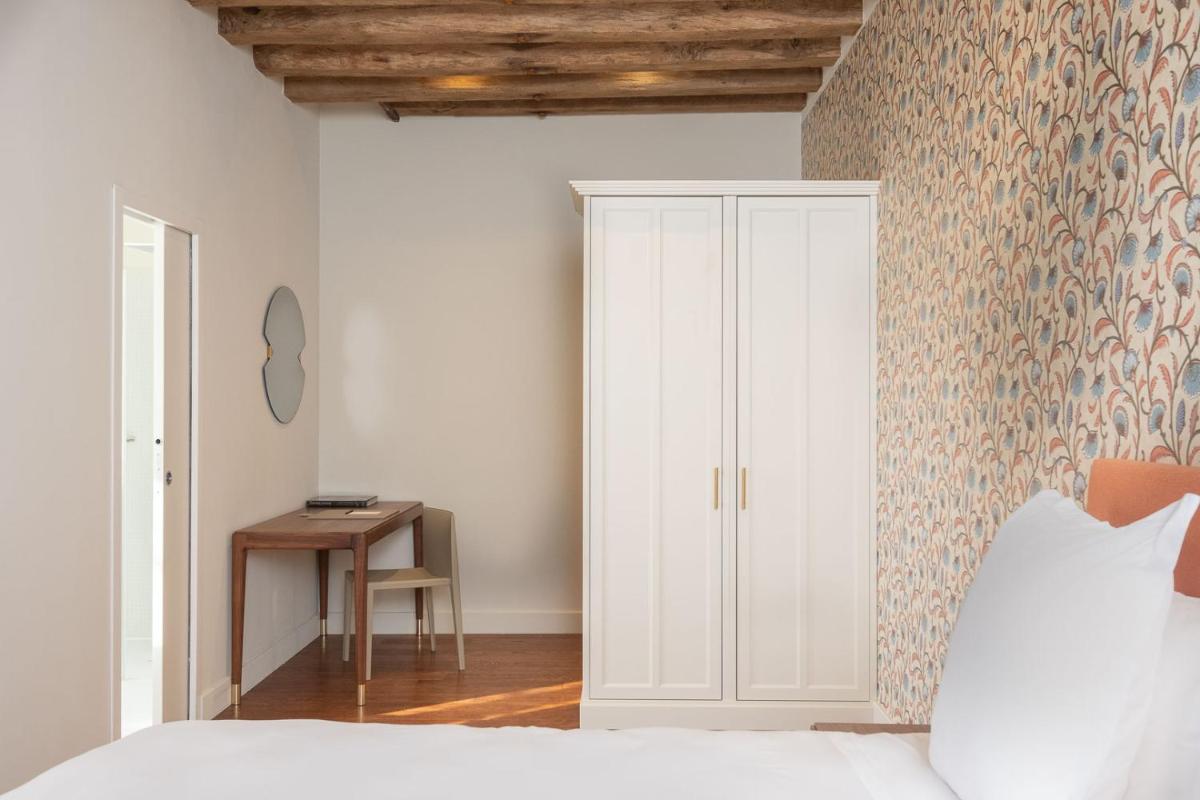 Un ou plusieurs lits dans un hébergement de l'établissement La Borde en Sologne Château & Spa