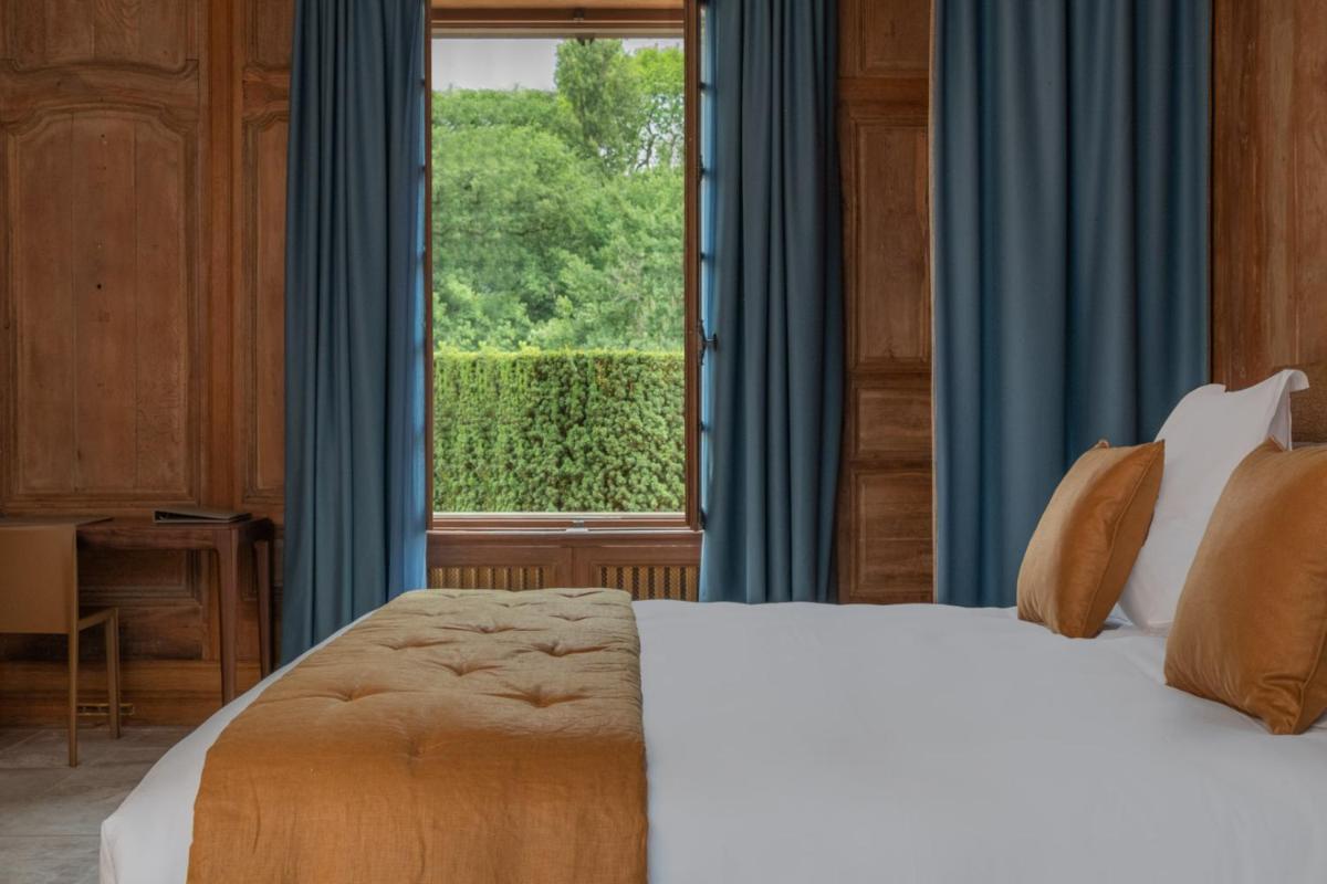 Un ou plusieurs lits dans un hébergement de l'établissement La Borde en Sologne Château & Spa