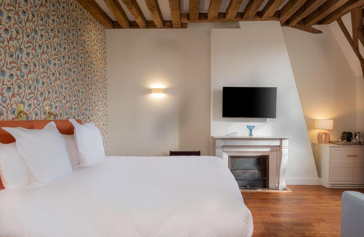 Un ou plusieurs lits dans un hébergement de l'établissement La Borde en Sologne Château & Spa