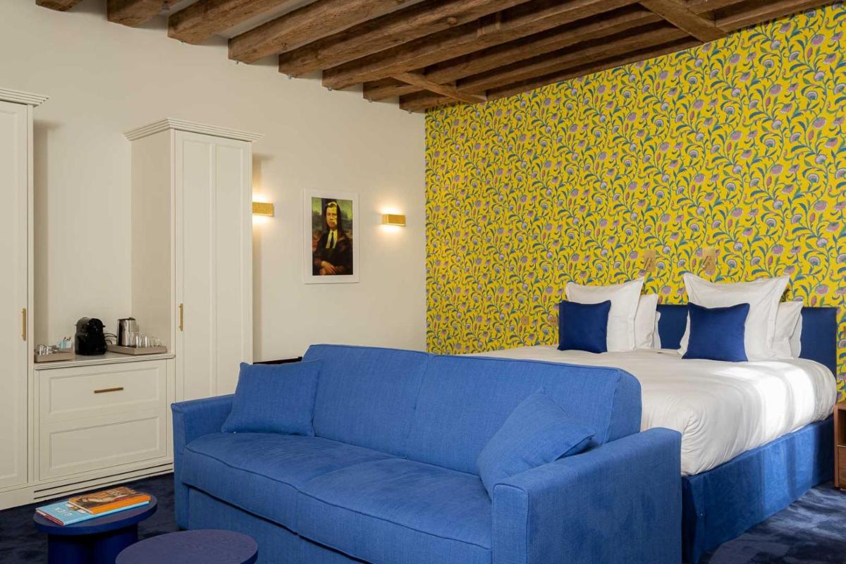 Un ou plusieurs lits dans un hébergement de l'établissement La Borde en Sologne Château & Spa