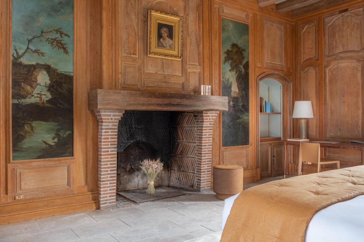 Un ou plusieurs lits dans un hébergement de l'établissement La Borde en Sologne Château & Spa