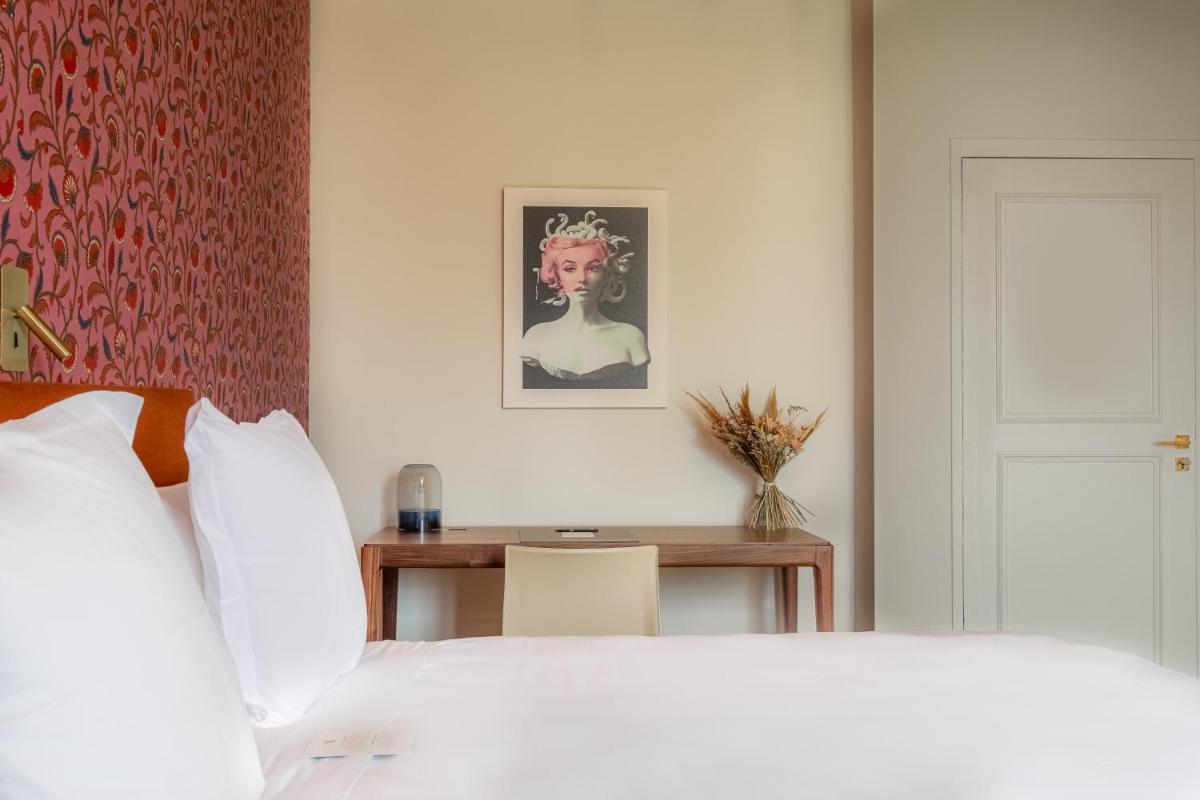 Un ou plusieurs lits dans un hébergement de l'établissement La Borde en Sologne Château & Spa