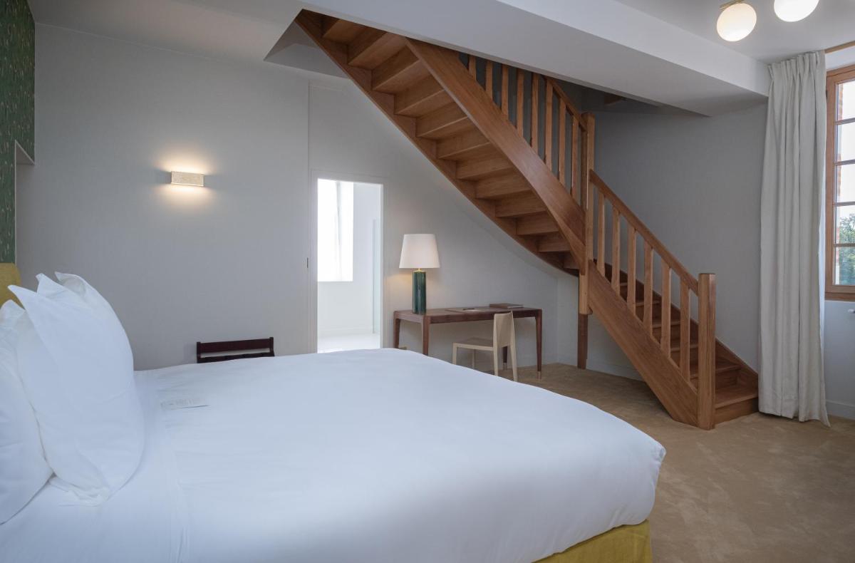 Un ou plusieurs lits dans un hébergement de l'établissement La Borde en Sologne Château & Spa