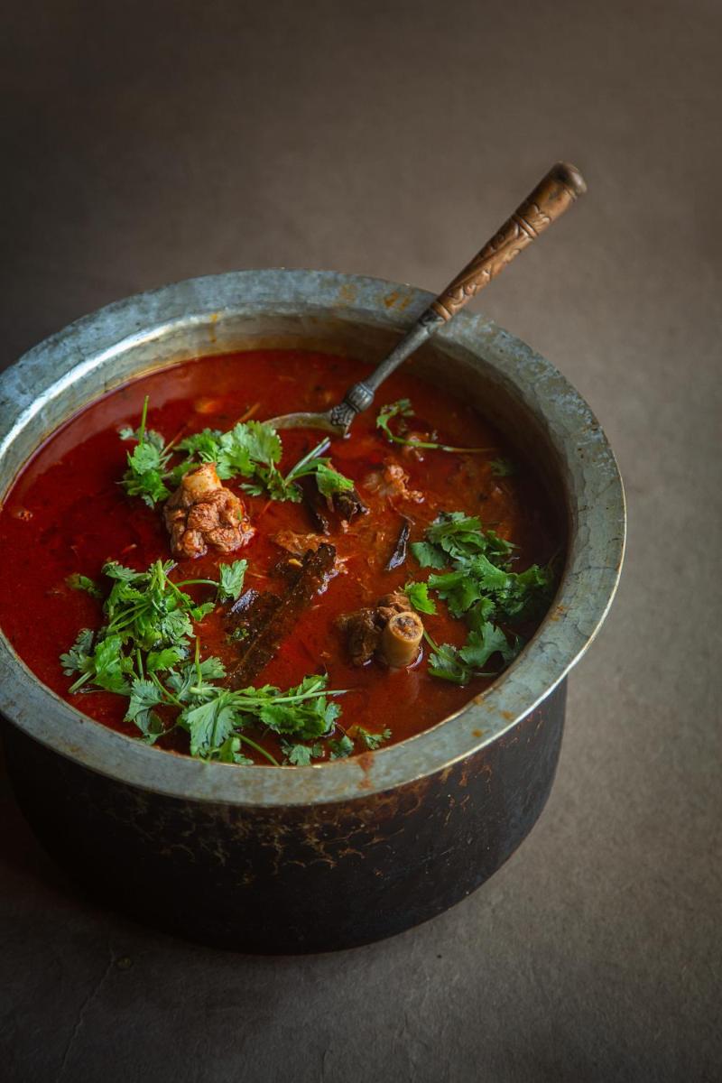 a bowl of soup with a spoon in it at Hyatt Regency Jaipur Mansarovar in Jaipur a bowl of soup with a spoon in it at Hyatt Regency Jaipur Mansarovar in Jaipur