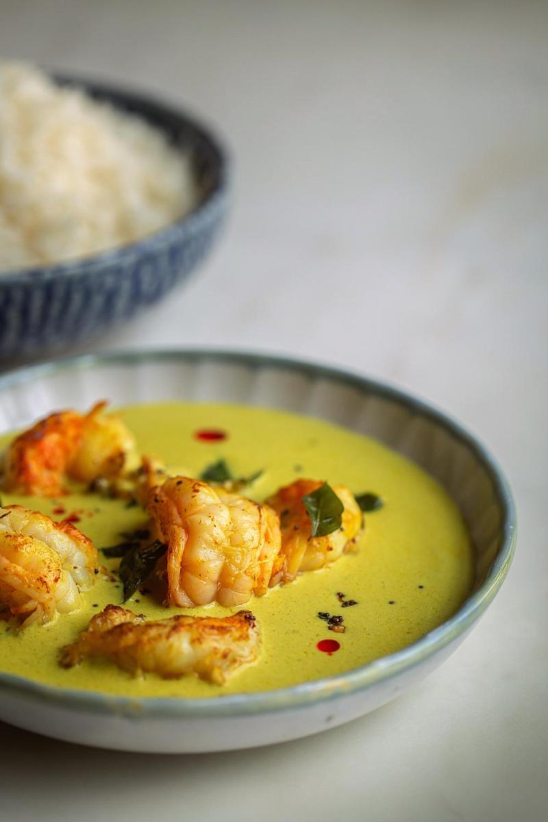 a bowl of yellow soup with shrimp in it at Hyatt Regency Jaipur Mansarovar in Jaipur a bowl of yellow soup with shrimp in it at Hyatt Regency Jaipur Mansarovar in Jaipur