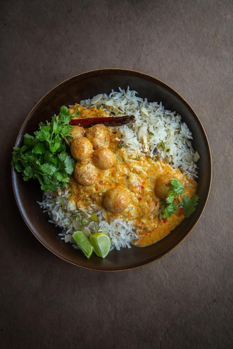 a plate of food with rice and meatballs at Hyatt Regency Jaipur Mansarovar in Jaipur a plate of food with rice and meatballs at Hyatt Regency Jaipur Mansarovar in Jaipur