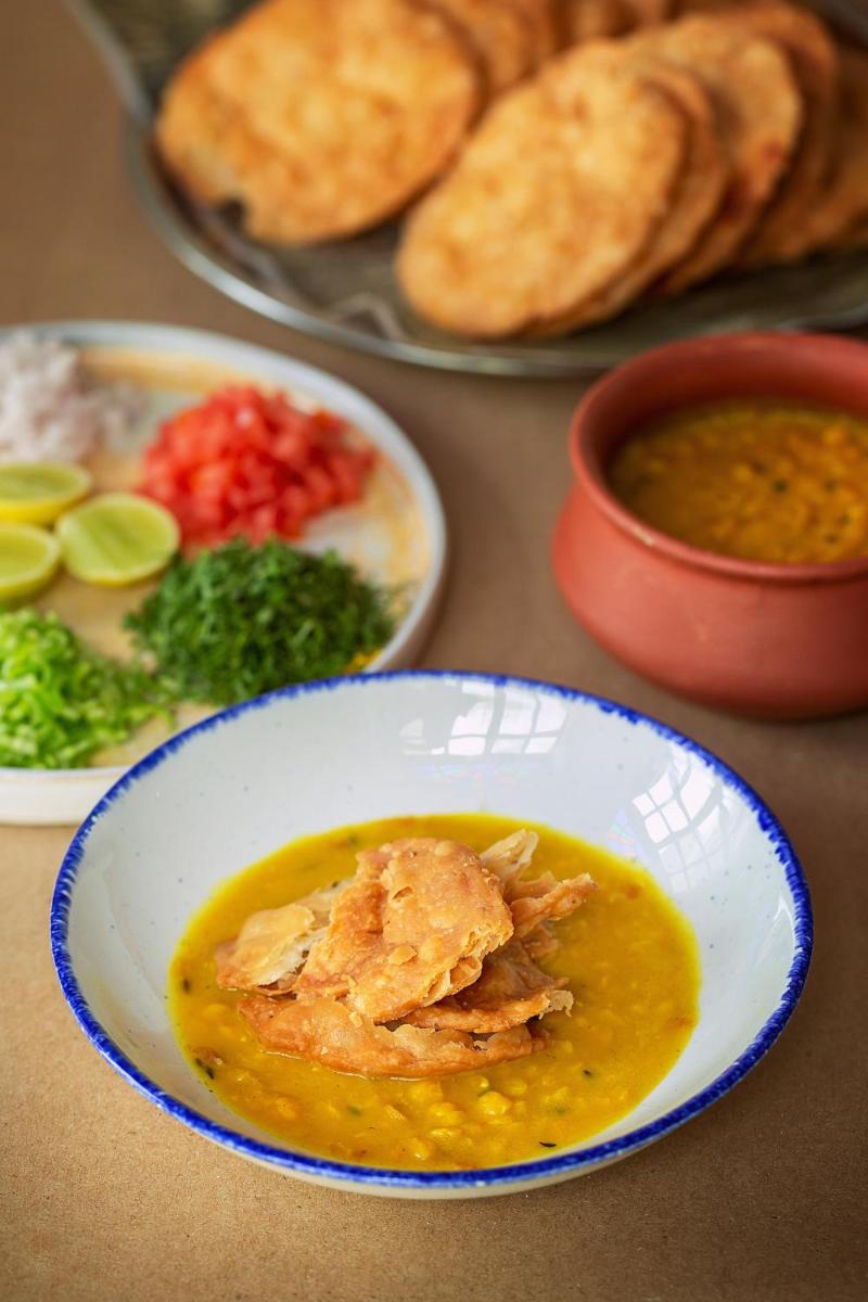 a table with a bowl of soup and plates of food at Hyatt Regency Jaipur Mansarovar in Jaipur a table with a bowl of soup and plates of food at Hyatt Regency Jaipur Mansarovar in Jaipur