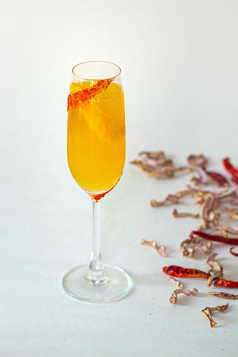 a glass of orange juice with an orange peel in it at Hyatt Regency Jaipur Mansarovar in Jaipur a glass of orange juice with an orange peel in it at Hyatt Regency Jaipur Mansarovar in Jaipur