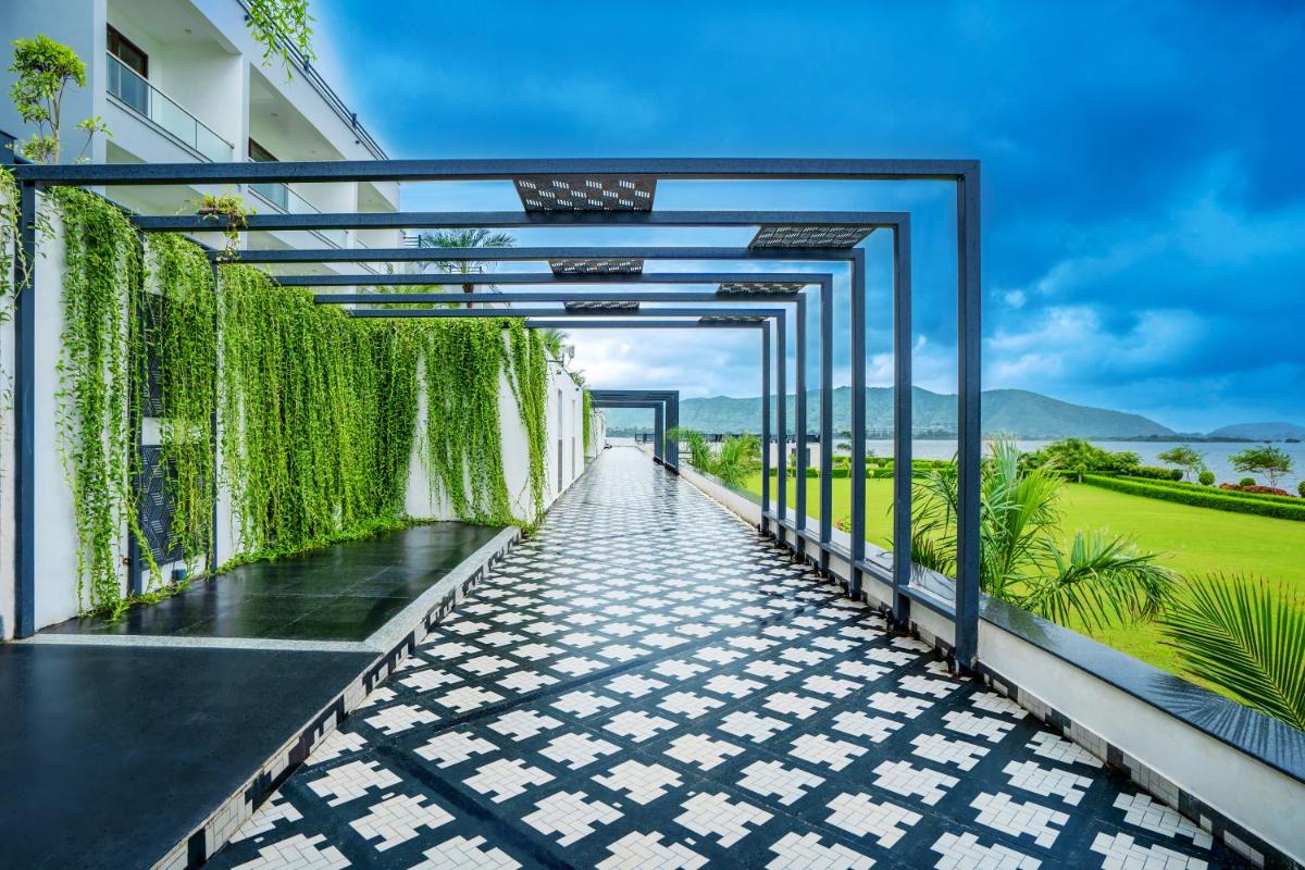a walkway on the side of a building at ZANA Lakeview Resort - most scenic lakeside resort in Udaipur