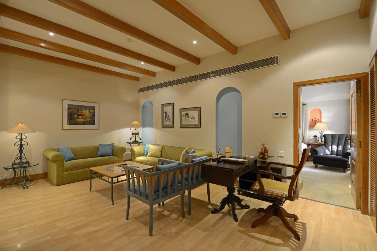 a living room with a couch and a table at Sun-n-Sand Mumbai Juhu Beach in Mumbai