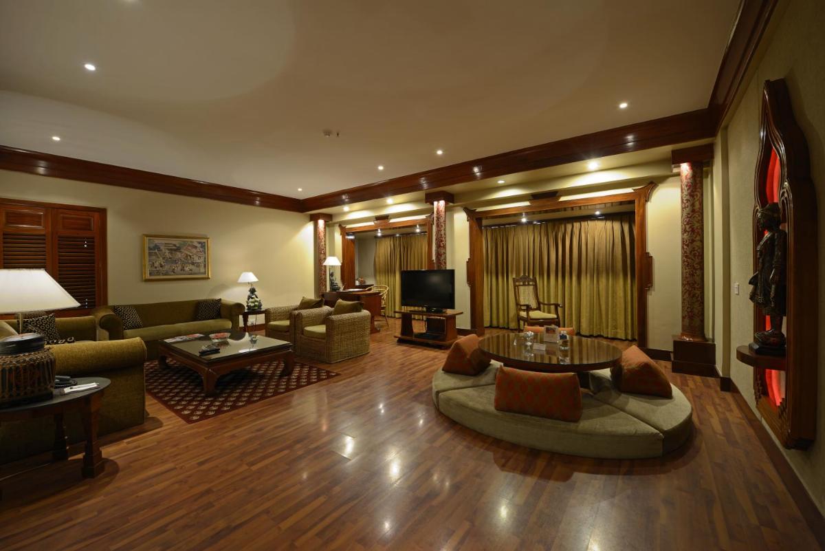 a large living room with a couch and a tv at Sun-n-Sand Mumbai Juhu Beach in Mumbai