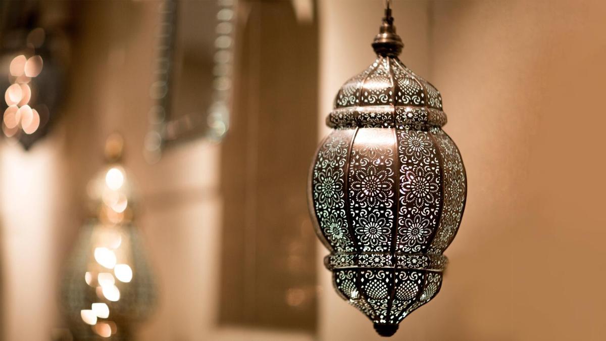 a close up of a lamp hanging from a wall at InterContinental Marine Drive Mumbai by IHG in Mumbai