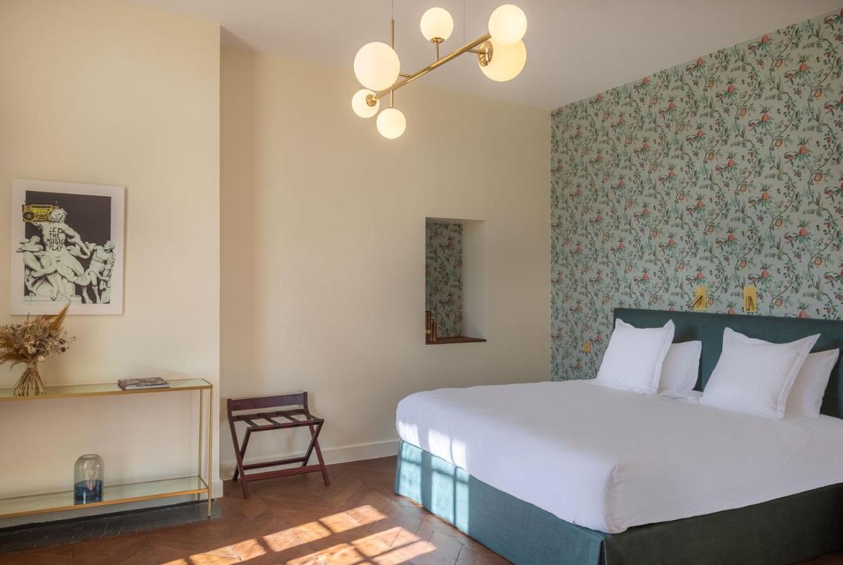 Un ou plusieurs lits dans un hébergement de l'établissement La Borde en Sologne Château & Spa