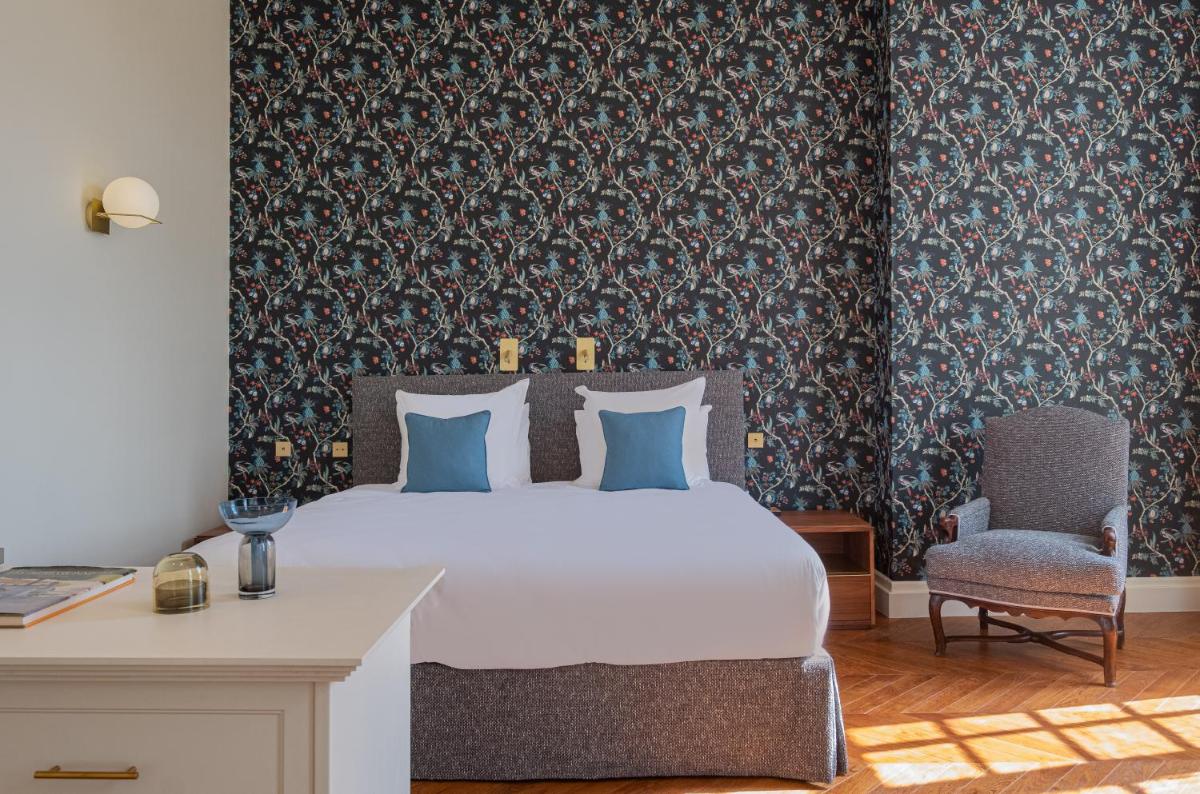 Un ou plusieurs lits dans un hébergement de l'établissement La Borde en Sologne Château & Spa