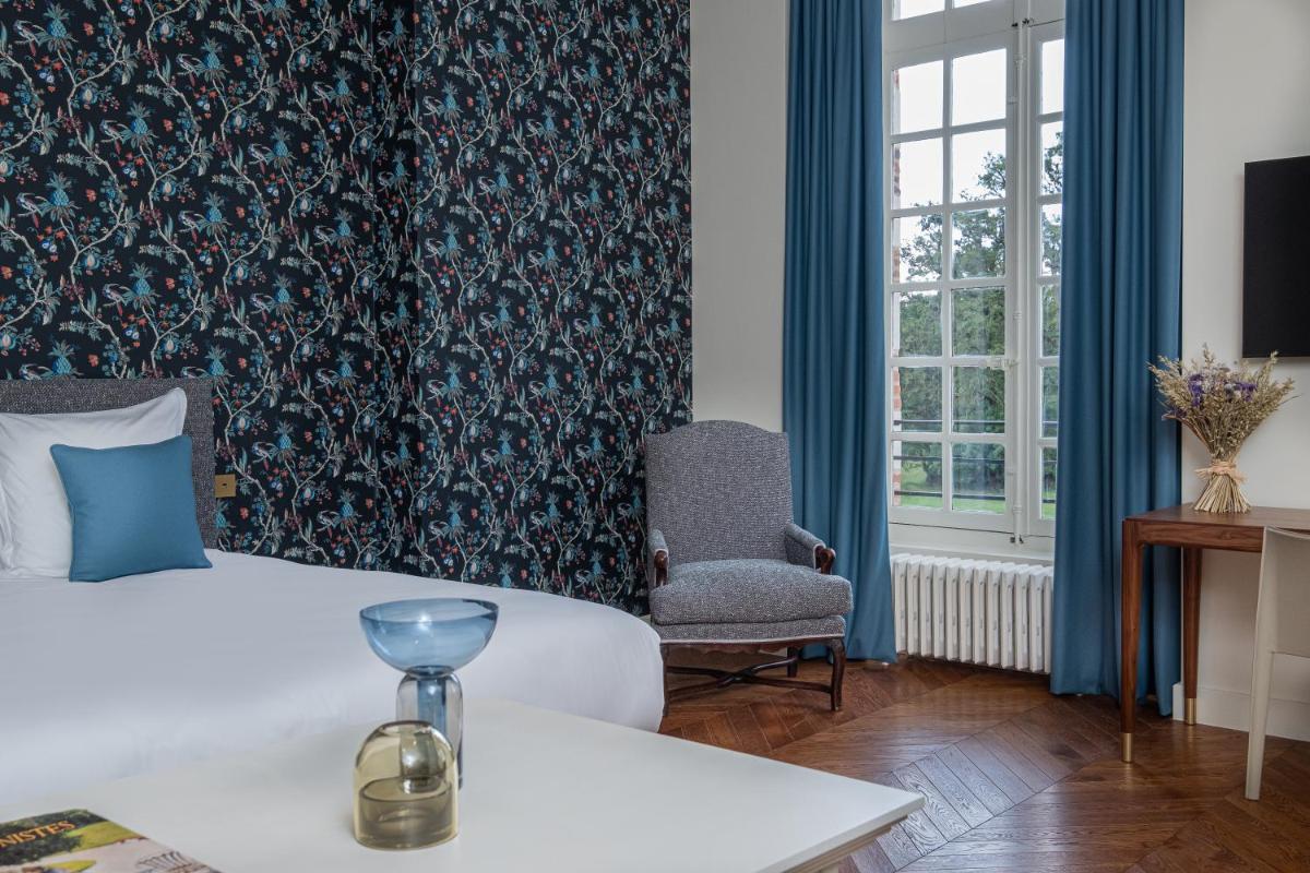 Un ou plusieurs lits dans un hébergement de l'établissement La Borde en Sologne Château & Spa
