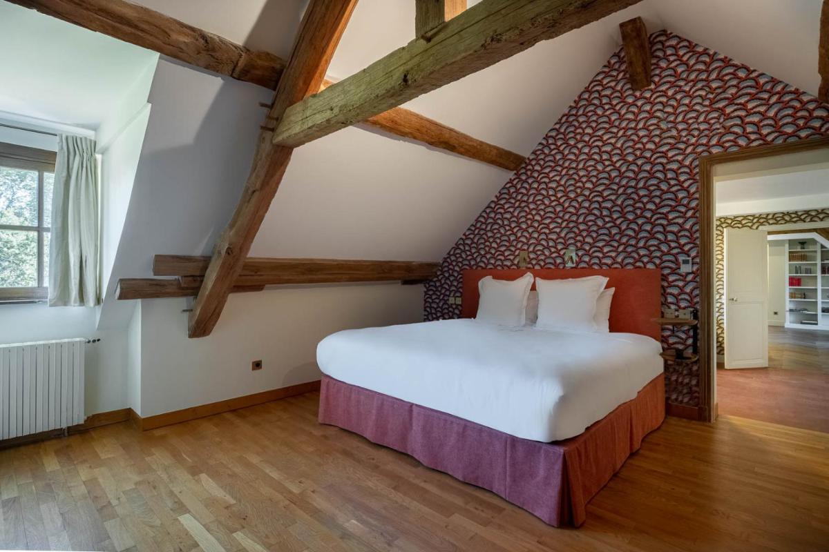 Un ou plusieurs lits dans un hébergement de l'établissement La Borde en Sologne Château & Spa