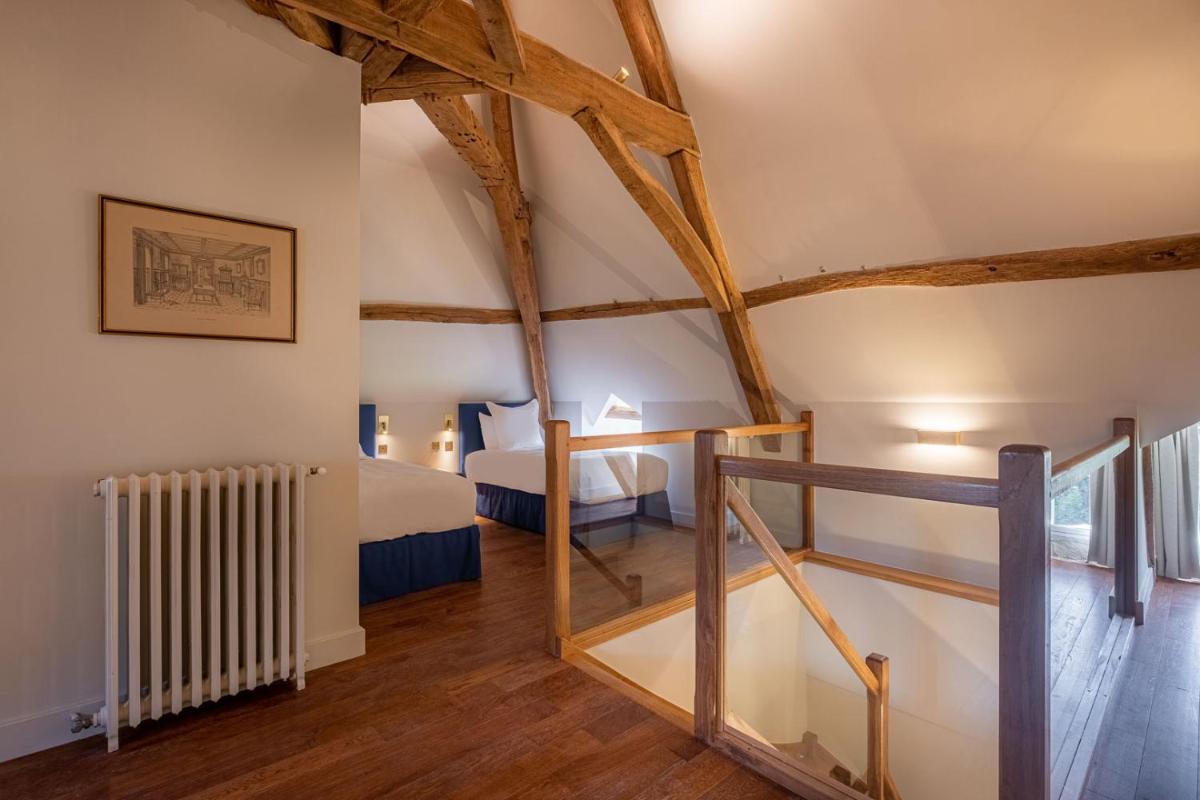 Un ou plusieurs lits dans un hébergement de l'établissement La Borde en Sologne Château & Spa
