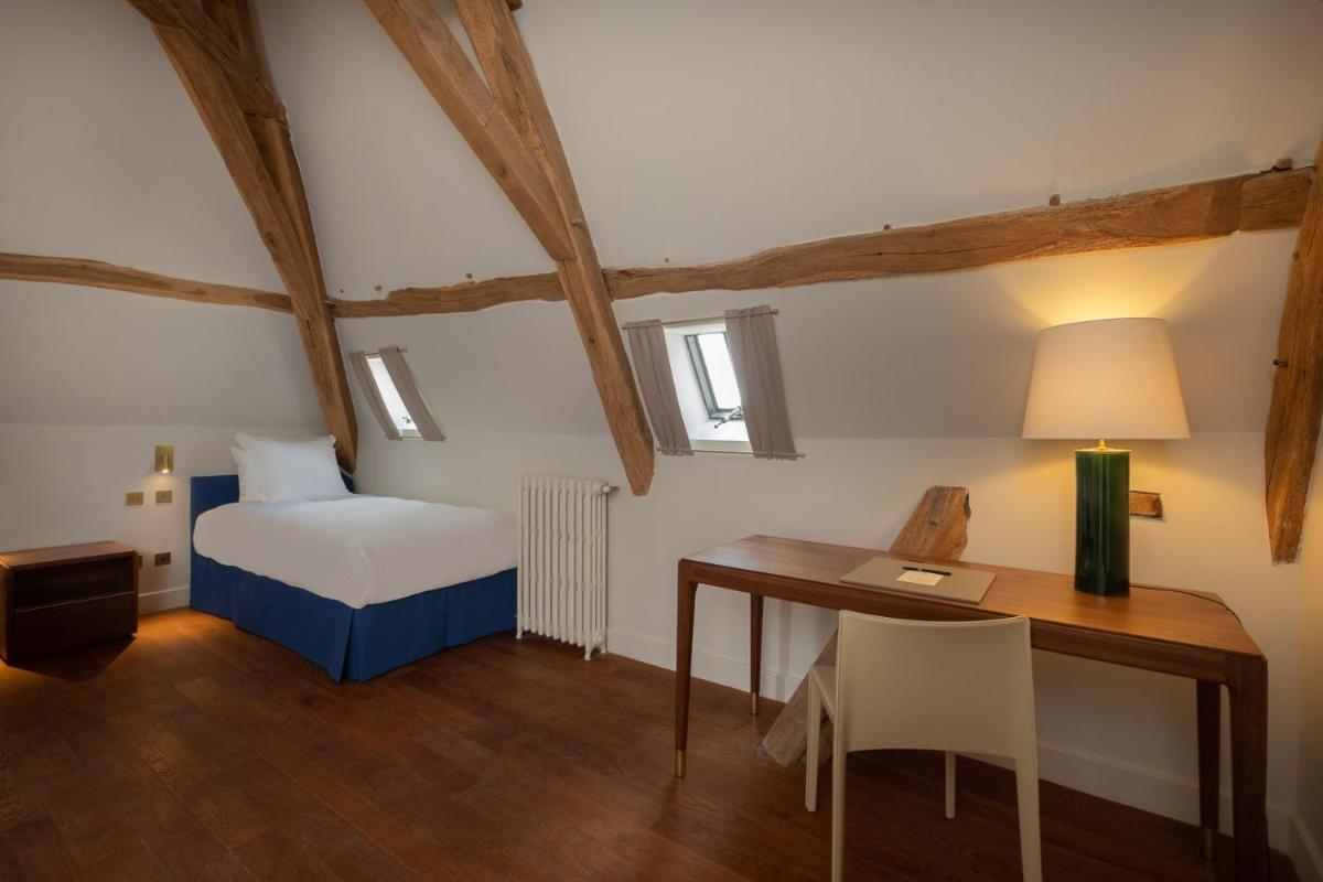 Un ou plusieurs lits dans un hébergement de l'établissement La Borde en Sologne Château & Spa