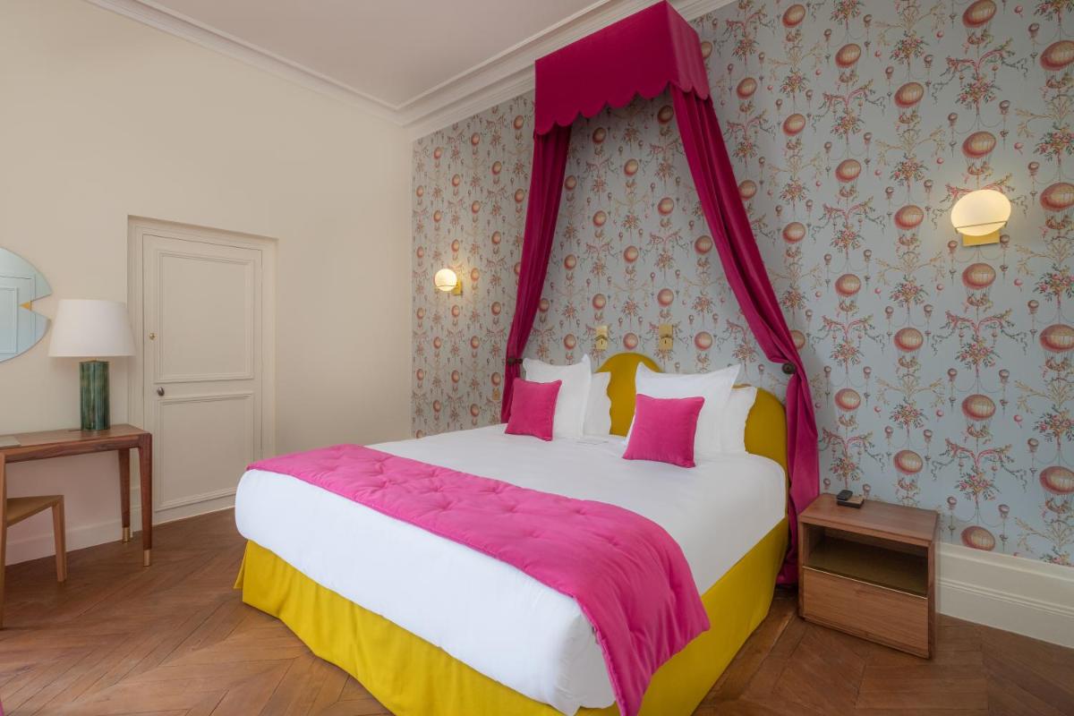 Un ou plusieurs lits dans un hébergement de l'établissement La Borde en Sologne Château & Spa