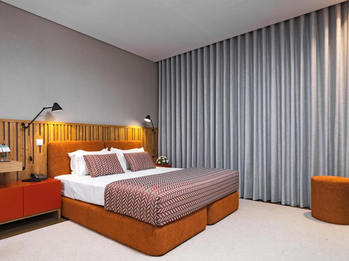 Uma cama ou camas num quarto em Central Monchique Hotel - Villa Termal Spa Resort - by Unlock Hotels